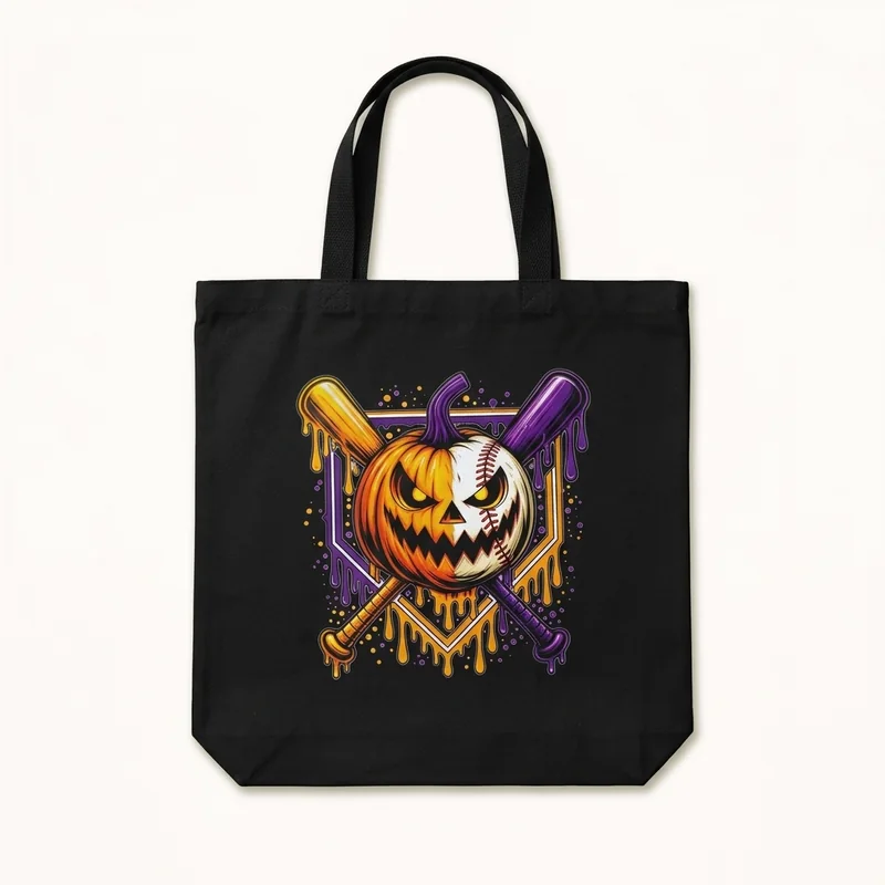 Black tote bag with a print of a half pumpkin, half baseball and crossed bats
